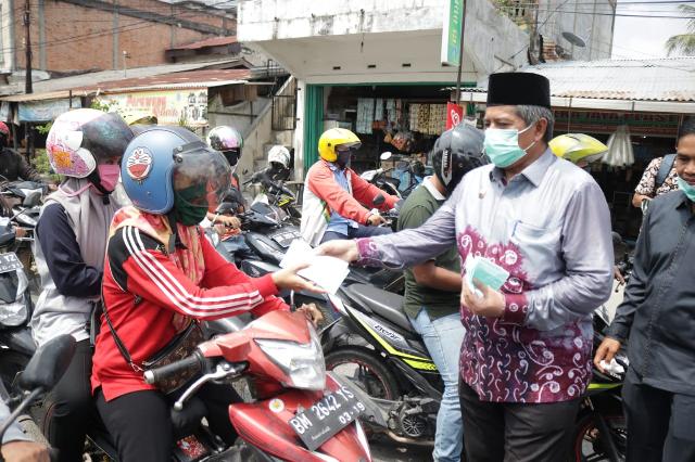 Bupati Siak dan Kapolres Canangkan Kawasan Wajib Helm dan Masker di Jalan Raya Perawang